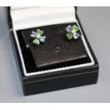 A pair of 18ct gold and gem set ear studs.