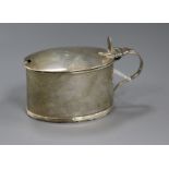 A George III silver oval mustard pot and cover.