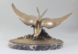 Ganu Gantcheff. An Art Deco bronze model of a seagull flying over waves, signed, on oval marble