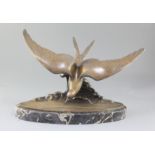 Ganu Gantcheff. An Art Deco bronze model of a seagull flying over waves, signed, on oval marble