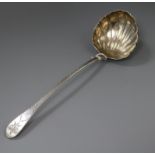 A George IV bright cut engraved silver celtic tip soup ladle with shell bowl, William Chawner II,