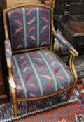 An unusual 19th century banded harewood open armchair