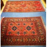 Two red ground rugs 190 x 107cm and 155 x 103cm