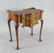 A late 18th century Dutch walnut and marquetry serpentine side table, with galleried top and two