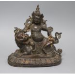 A Chinese bronze group of Vaisravana riding a snow lion height 18.5cm