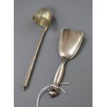 A 1930's Georg Jensen sterling silver cream ladle and a Georg Jensen silver caddy spoon.