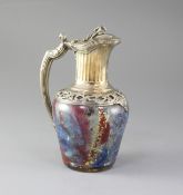 A French 950 standard silver gilt mounted coloured crackle glass claret jug, with vineous