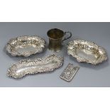 A pair of silver bonbon disher, a silver pin tray, a Victorian silver christening mug and a silver