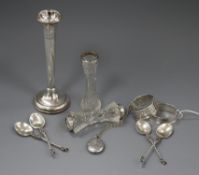 Two silver napkin rings, a silver vase, silver mounted vase, four silver spoons, silver locket and a