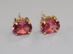 A pair of 18ct yellow gold and pink tourmaline stud earrings, the single oval stones 3.297ct in