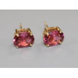 A pair of 18ct yellow gold and pink tourmaline stud earrings, the single oval stones 3.297ct in
