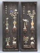 A pair of Chinese hardstone and soapstone mounted panels length 69cm