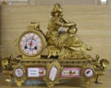 A late 19th century French eight day gilt spelter eight day mantel clock, inset Sevres style