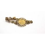 A 1982 HALF SOVEREIGN in a 9 carat gold four bar gate bracelet, 11g gross