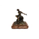 A PATINATED CAST METAL FIGURE OF NEPTUNE RIDING UPON THE WAVES mounted on a shaped wooden plinth