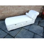 AN UPHOLSTERED OTTOMAN/DAY BED with scroll end and lift up seat, height 68cm length 164cm width
