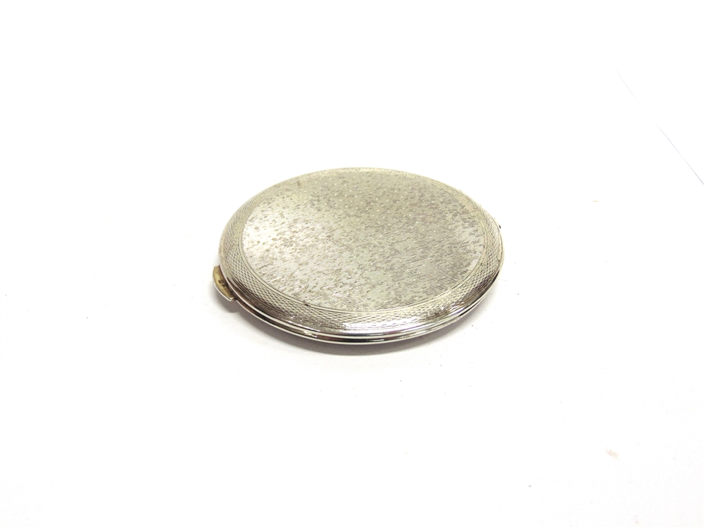 A KIGU SILVER COMPACT London 1964, 8.3cm diameter with felt outer case - Image 2 of 2