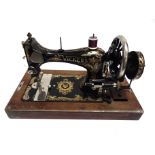 A VICKERS 'MODELE DE LUXE' SEWING MACHINE cased.