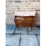 A CONTINENTAL COMMODE CHEST OF BOMBE OUTLINE the shaped flecked marble top with two drawers under