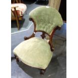 A VICTORIAN CARVED WALNUT FRAMED NURSING CHAIR with button upholstery