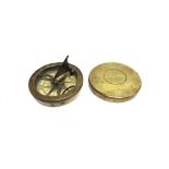 A BRASS POCKET SUNDIAL & COMPASS with a folding gnomen, the chapter ring engraved in Roman