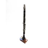 A CLARINET complete with mouth-piece and reeds, uncased.