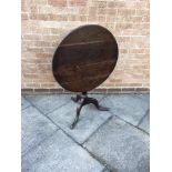 A PROVINCIAL OAK TRIPOD OCCASIONAL TABLE the circular tilt top 73cm diameter, 68cm high