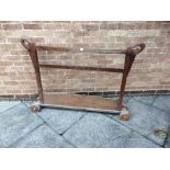 A WOODEN TWO BAR FOUR WHEELED PULL ALONG GATE height 98cm width 140cm