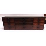 A MAHOGANY BANK OF TWELVE DRAWERS the top with crossbanded decoration, 91cm wide 22cm deep 30cm high