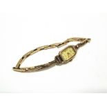 ROTARY, A LADY'S 9 CARAT GOLD QUARTZ WRIST WATCH on a 9 carat gold expanding bracelet, 12.4g gross