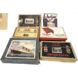 SEVEN WOODEN JIGSAW PUZZLES comprising a G.W.R. 'The Cornish Riviera Express'; G.W.R. 'The