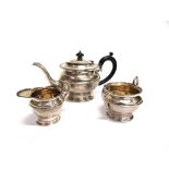 A THREE PIECE SILVER TEA SERVICE London 19 , of round form with shaped moulded rims, 722g (23.2 troy