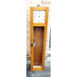 A 'GENTS OF LEICESTER' ELECTRIC CLOCK with enamel dial, in light oak case, with bracket for wall