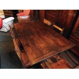 A REFECTORY STYLE DARK OAK RECTANGULAR DINING TABLE the twin bulbous supports joined by stretcher