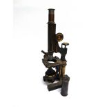 A BRASS MONOCULAR MICROSCOPE by W. Watson & Sons, London, serial number 2948.