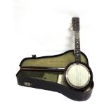 A FIVE-STRING BANJO cased.