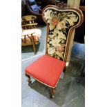 A VICTORIAN CARVED MAHOGANY FRAMED NURSING CHAIR the backrest with needlework decoration, on