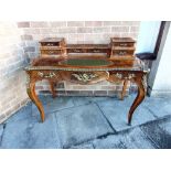 A CONTINENTAL INLAID AND GILT MOUNTED LADIES WRITING DESK of serpentine outline, with central drawer