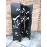 A THREE FOLD LACQUER SCREEN decorated with exotic birds, blossom and foliage, height 184cm width