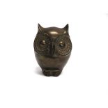 A BRASS FIGURE OF A STYLISED OWL 16cm high