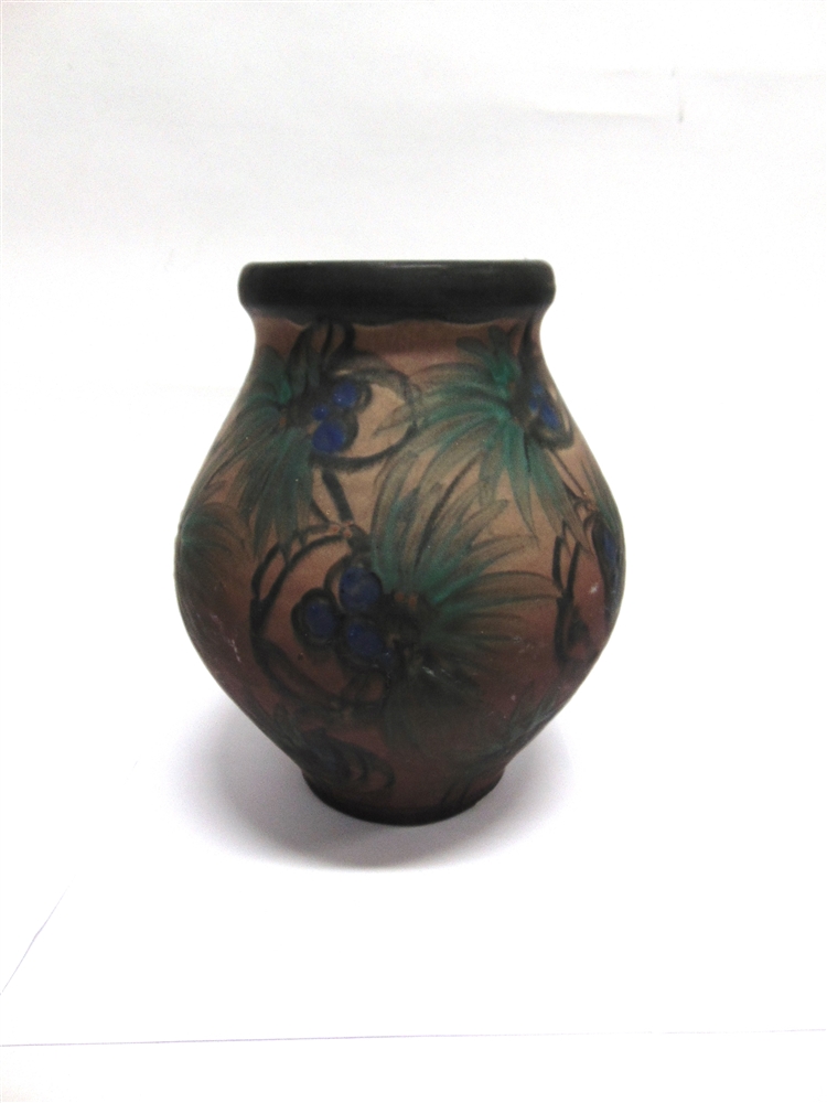 A LARGE DANISH ART POTTERY VASE decorated in blue and green floral motifs on a brown ground, incised