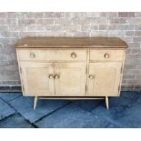 A SMALL LIGHT ERCOL SIDEBOARD with elm plank top above beech front with drawers over cupboards,