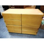 A LIGHT OAK VENEERED BANK OF SEVEN DRAWERS with leather drawer pulls, 100cm wide 50cm deep 74cm