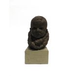 A PATINATED COMPOSITION MAQUETTE BUST OF A BABY 26cm high, set to a painted wooden block base,