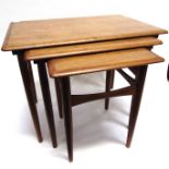 A DANISH NEST OF THREE TEAK TABLES the largest 59cm wide 39cm deep 47cm high, stamped 'Made in