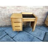 A STAG LIGHT OAK DRESSING CHEST with black metal covered top opening to vanity mirror, three