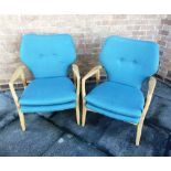 A PAIR OF LIGHT OAK FRAMED LOUNGE ARMCHAIRS with turquoise coloured fabric upholstery, unmarked