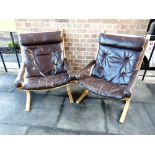 INGMAR RELLING FOR WESTNOFA: a pair of 'Siesta' lounge armchairs, with brown leather cushions on a