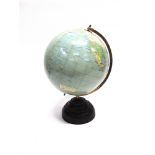 A 10' DESK GLOBE ON CIRCULAR STEPPED BAKELITE BASE labelled 'THE PARAMOUNT BY GEOGRAPHIA OF FLEET