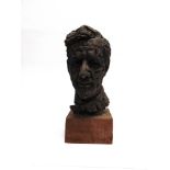 A PATINATED CLAY MAQUETTE BUST OF A BEARDED MAN 34cm high, set to a wooden block base, overall 43.